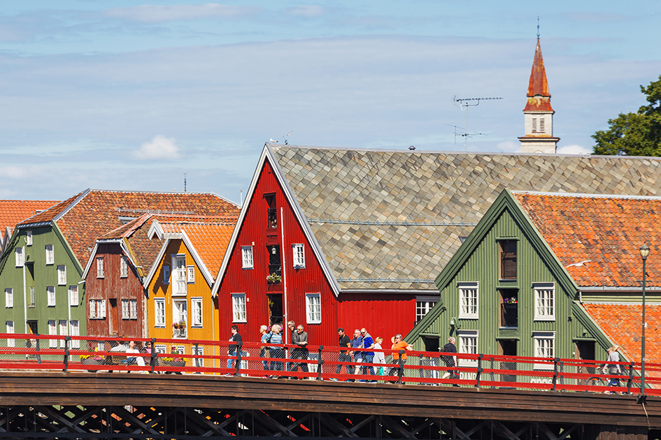 Pedestrains walking over bridge in Trondheim