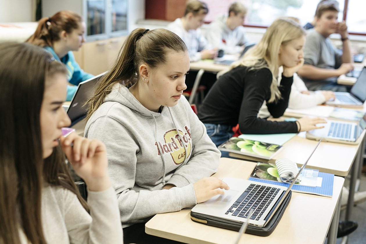 Students in classroom, with computers