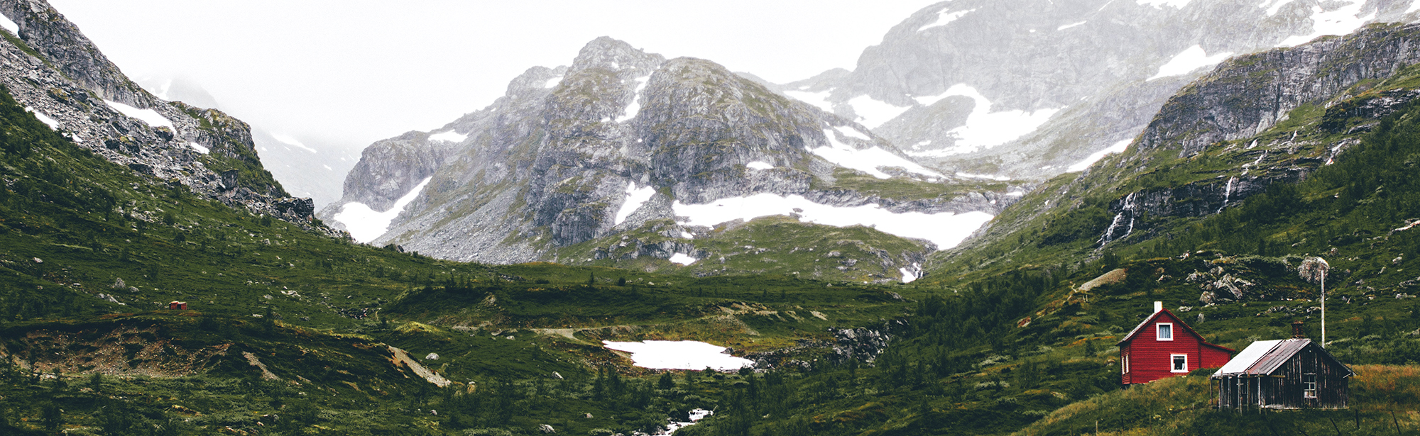 Red house in alp landscape