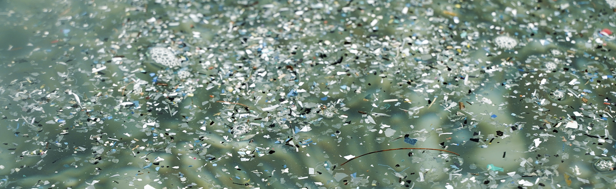 Microplastic pieces in water