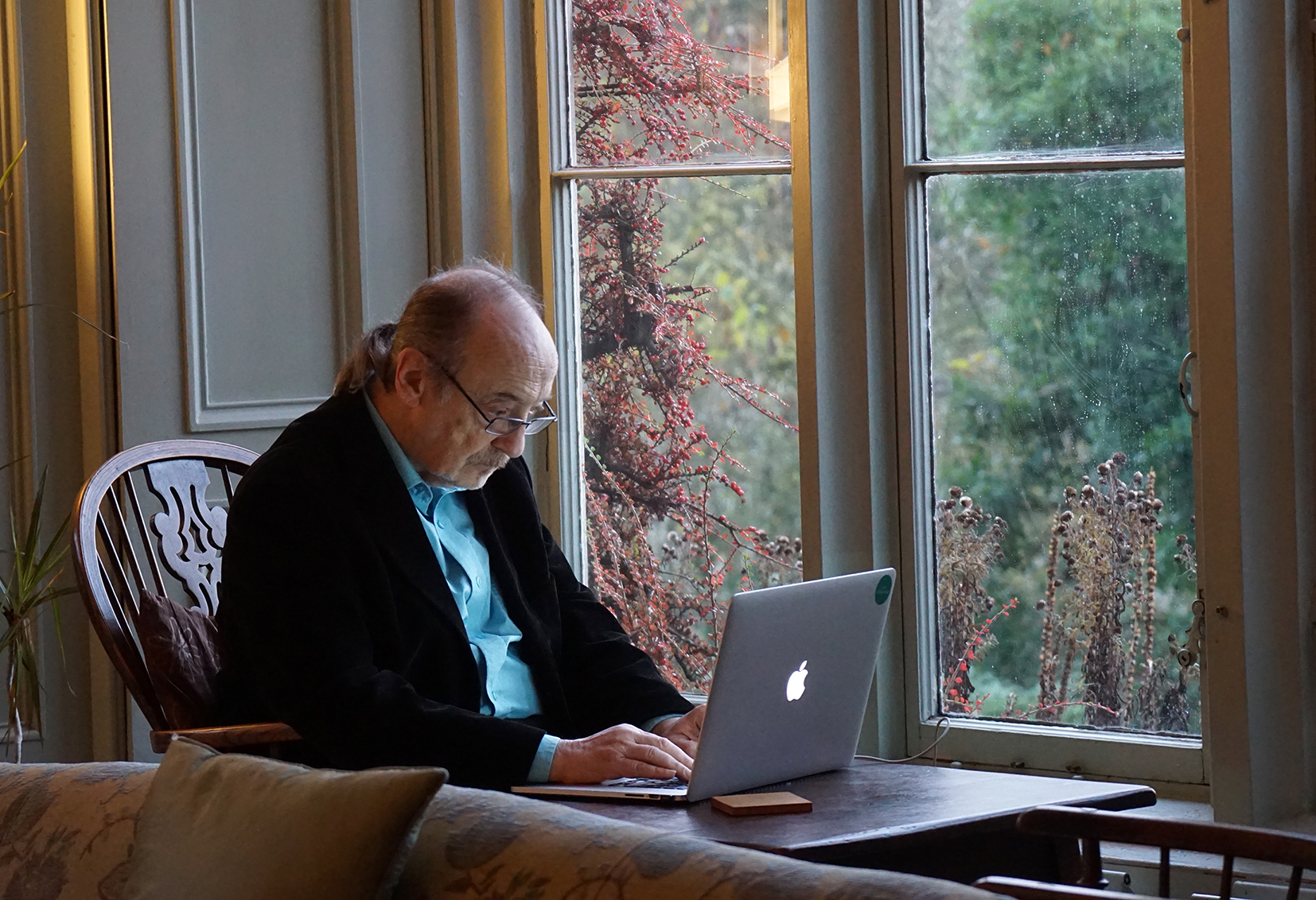 Elder man with computer