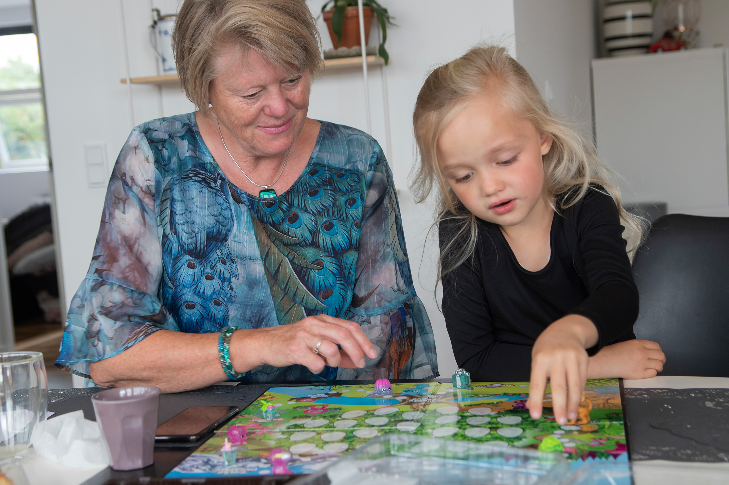 grandmother and young girl playing