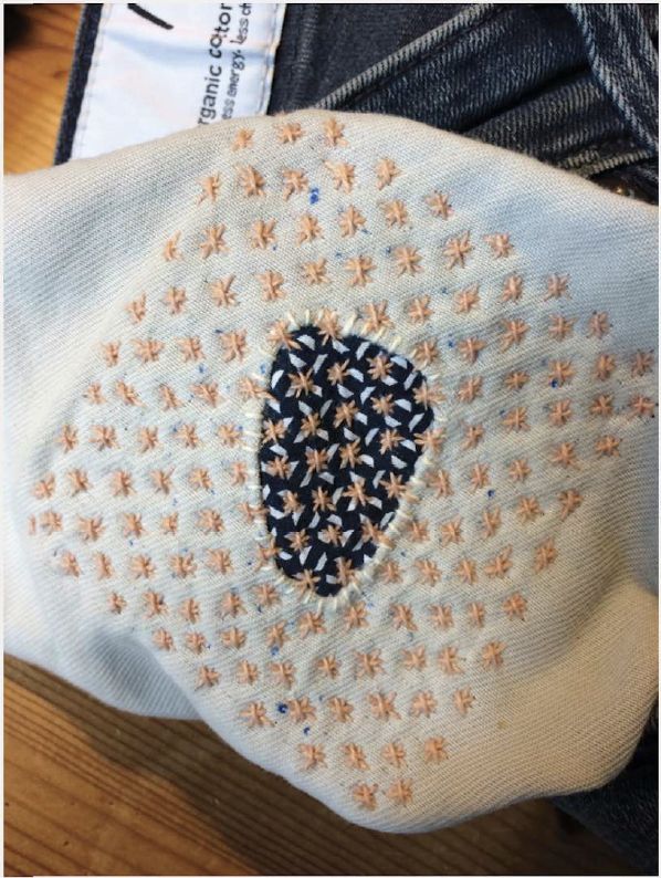 Picture shows a repair using the Sashiko method